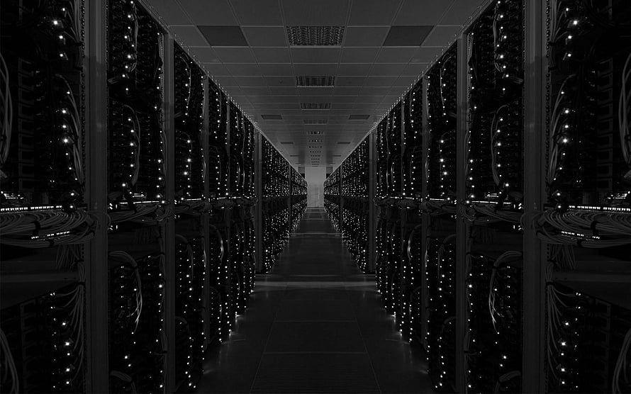 Dark Data Center Aisle with Rows of Server Racks and Glowing Indicator Lights HD wallpaper