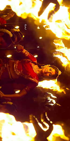 Sai Pallavi in Traditional Red Attire Amidst Dramatic Fire and Smoke HD phone wallpaper