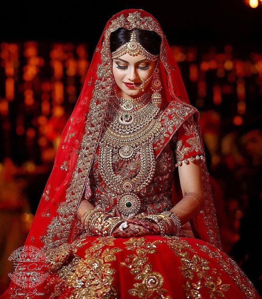 Elegant Indian Bride in Red Lehenga with Heavy Gold Jewelry and Henna HD phone wallpaper