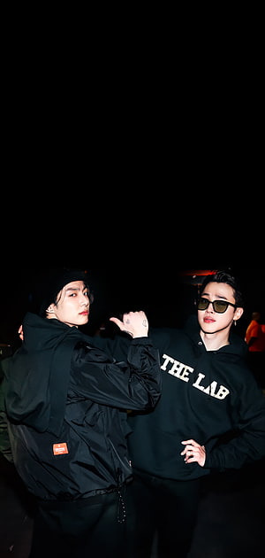 Stray Kids Bang Chan and Lee Know posing in black streetwear at night HD phone wallpaper