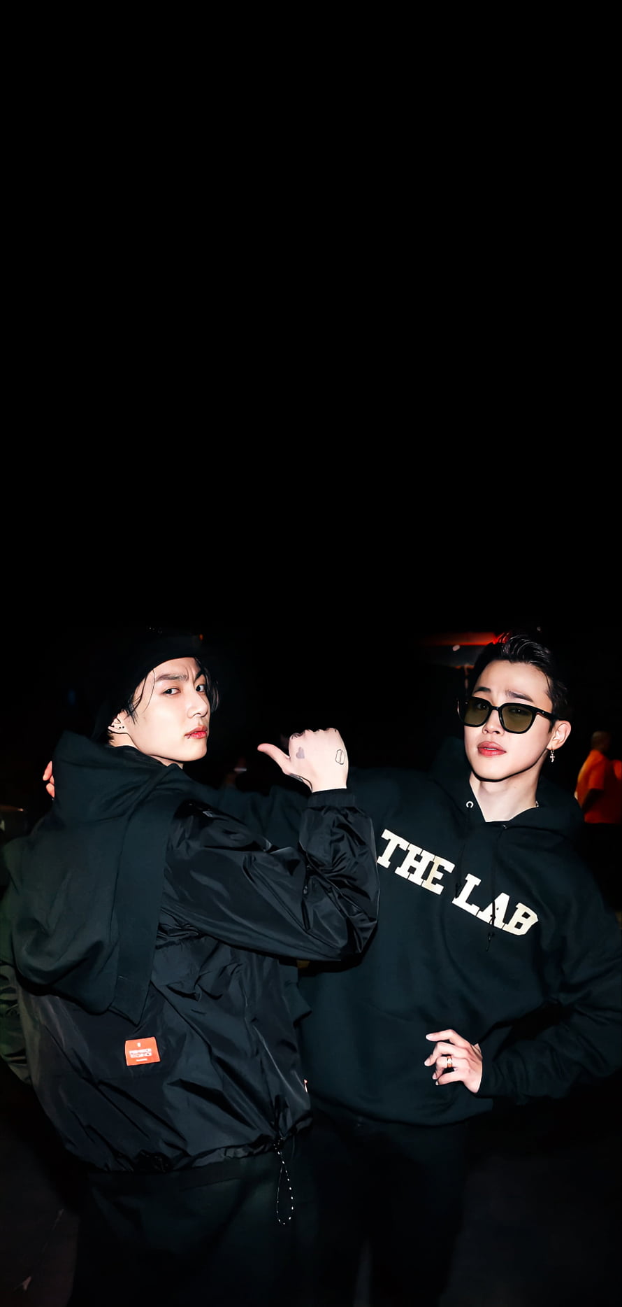 Stray Kids Bang Chan and Lee Know posing in black streetwear at night HD phone wallpaper