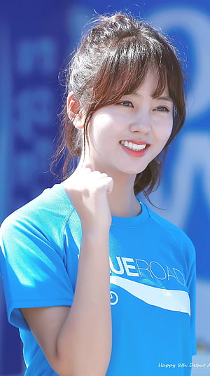 Kim So Hyun in a Blue Sports T-Shirt with a Bright Smile and Fist Gesture HD phone wallpaper