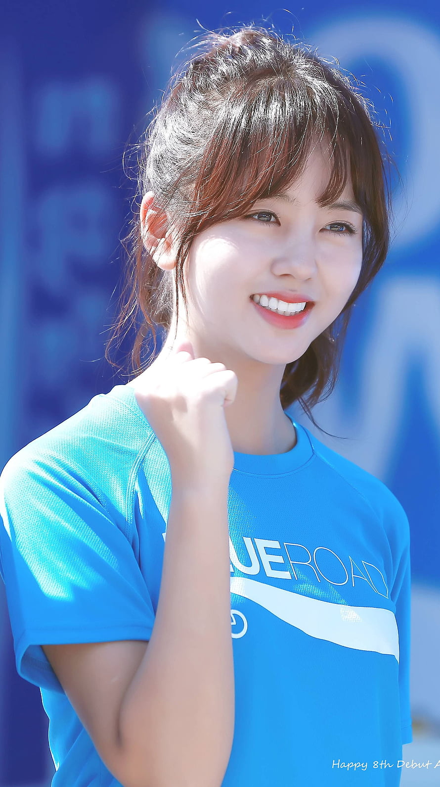 Kim So Hyun in a Blue Sports T-Shirt with a Bright Smile and Fist Gesture HD phone wallpaper