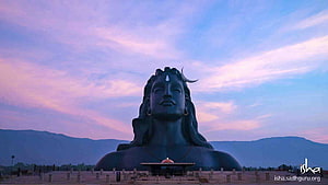 Adiyogi Statue at Isha Yoga Center Against a Pastel Sunset Sky HD wallpaper