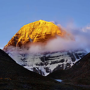 Golden Sunrise Illuminating the Sacred Peak of Mount Kailash in the Himalayas HD phone wallpaper