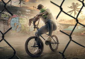 Urban BMX Rider on Bike in Graffiti Alley at Sunset HD wallpaper