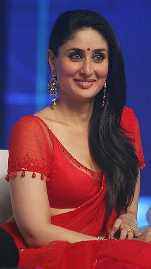 Kareena Kapoor Khan in a vibrant red saree with traditional jewelry and elegant makeup HD phone wallpaper