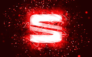 Glowing White Seat Logo on Fiery Red Particle Background HD wallpaper