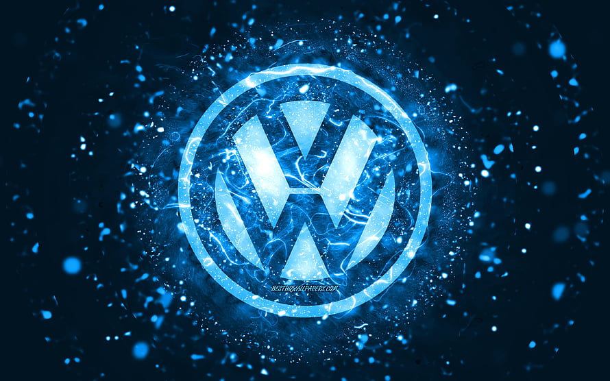 Volkswagen emblem glowing with electric blue energy and particle effects on a dark background HD wallpaper