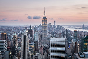Aerial View of New York City Skyline Featuring the Empire State Building at Sunset HD wallpaper