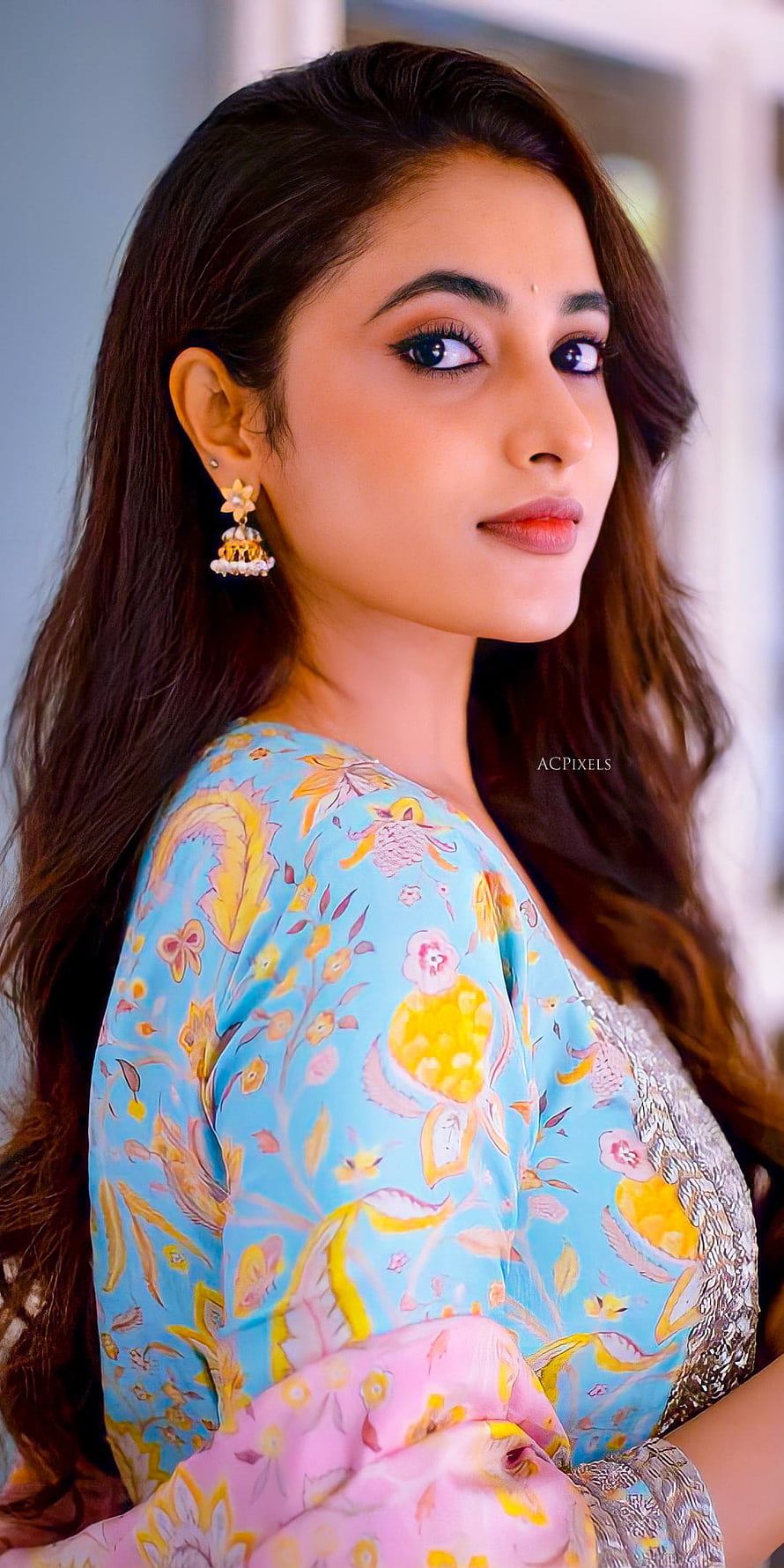 Priyanka Mohan in a floral blue and pink traditional outfit with gold jhumka earrings HD phone wallpaper