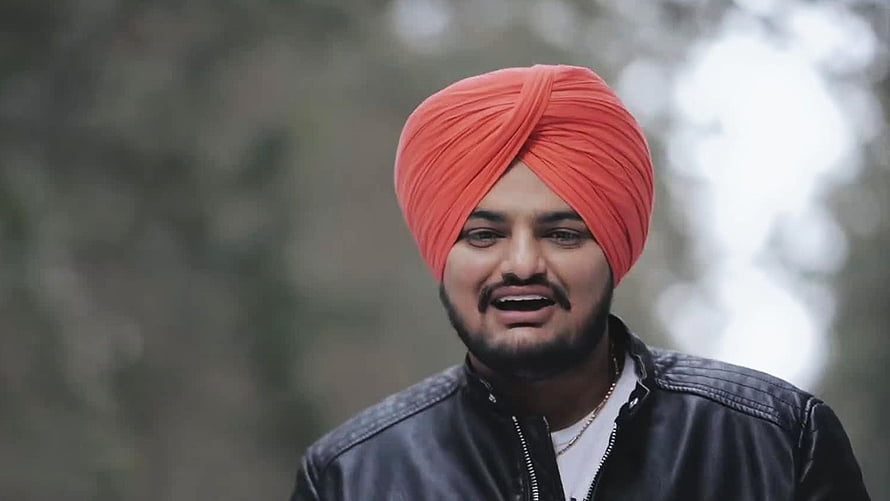 Portrait of a man wearing a bright orange turban and black leather jacket outdoors, Sandhu Moose Wala Psy Info, Sidhu Moose Wala HD wallpaper