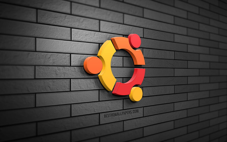 Ubuntu 3D logo mounted on a dark gray brick wall with vibrant orange and yellow accents HD wallpaper