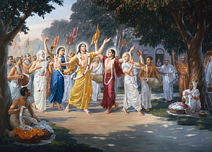 Chaitanya Mahaprabhu Leading Devotees in Kirtan Under Flowering Trees HD wallpaper