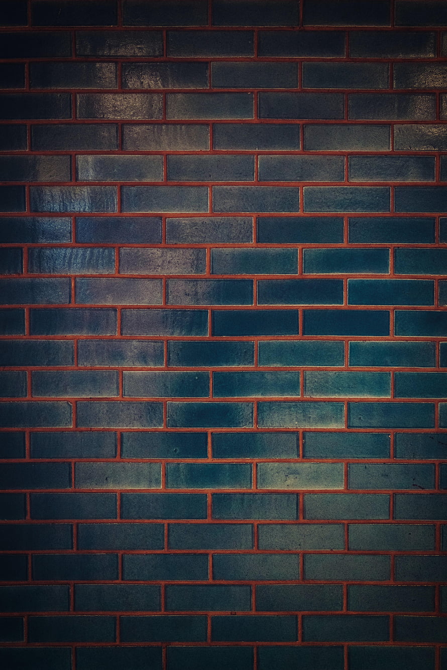 Dark Textured Brick Wall Pattern with Deep Blue and Teal Tones HD phone wallpaper