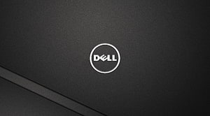 Dell Inspiron Laptop Lid Close-Up With Silver Logo On Dark Textured Surface HD wallpaper