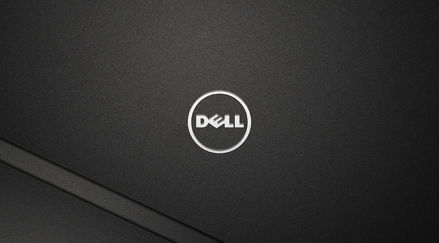 Dell Inspiron Laptop Lid Close-Up With Silver Logo On Dark Textured Surface HD wallpaper