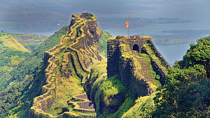 Rajmachi Fort in Maharashtra India with lush green hills and scenic lake view HD wallpaper