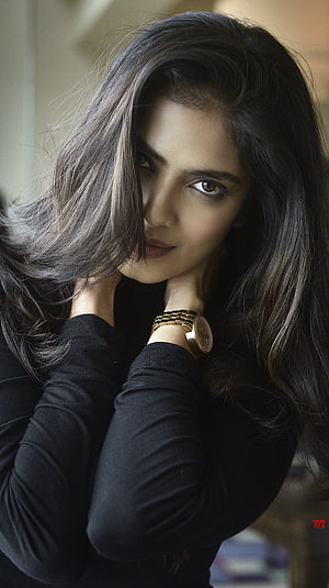 Malavika Mohanan Portrait in Black Top with Gold Watch HD phone wallpaper