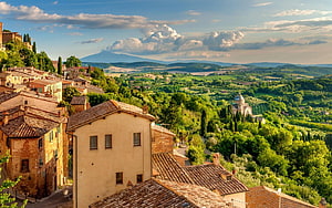 Tuscany Italy Hilltop Village with Terracotta Roofs and Rolling Green Valleys HD wallpaper