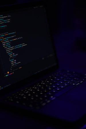Dark Mode Programming on a Laptop Screen with Syntax Highlighted Code HD phone wallpaper