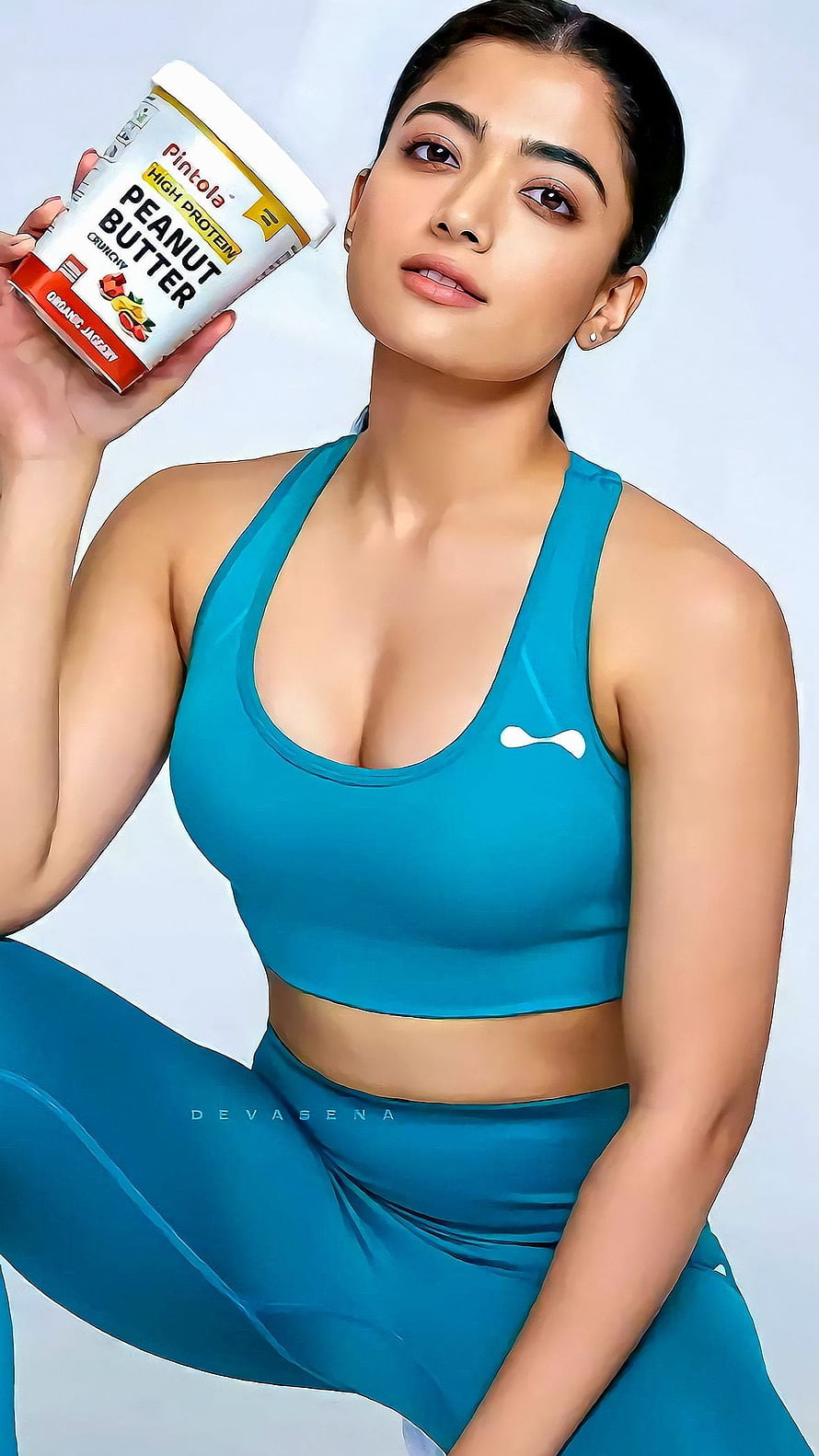 Pooja Hegde in Blue Gym Wear Holding Pintola Peanut Butter HD phone wallpaper
