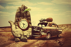 Surreal desert scene with stone hand holding pocket watch, vintage car, cat, and pineapple HD wallpaper