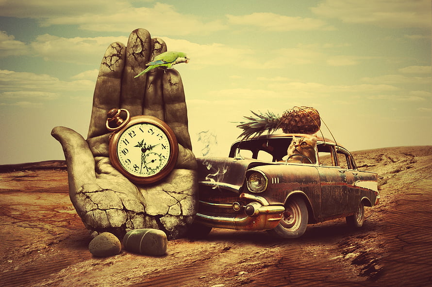 Surreal desert scene with stone hand holding pocket watch, vintage car, cat, and pineapple HD wallpaper