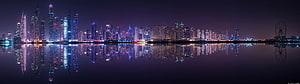 Doha Skyline Night Panorama With Reflections In The Water HD wallpaper