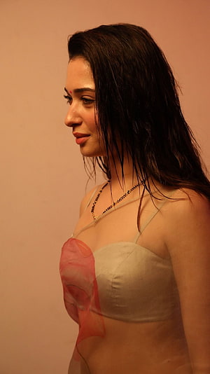 Tamanna Bhatia in a beige top with a red floral overlay and delicate necklace HD phone wallpaper