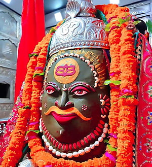 Khatu Shyam Ji Temple Idol Close-Up With Marigold Garlands And Silver Crown HD phone wallpaper