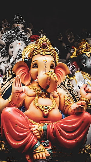 Lord Ganesha Murti in Red Dhoti with Gold Crown and Jewelry HD phone wallpaper