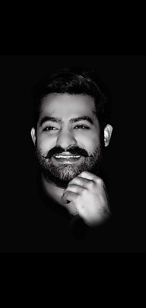 Black and White Portrait of NTR with Beard and Hand on Chin HD phone wallpaper