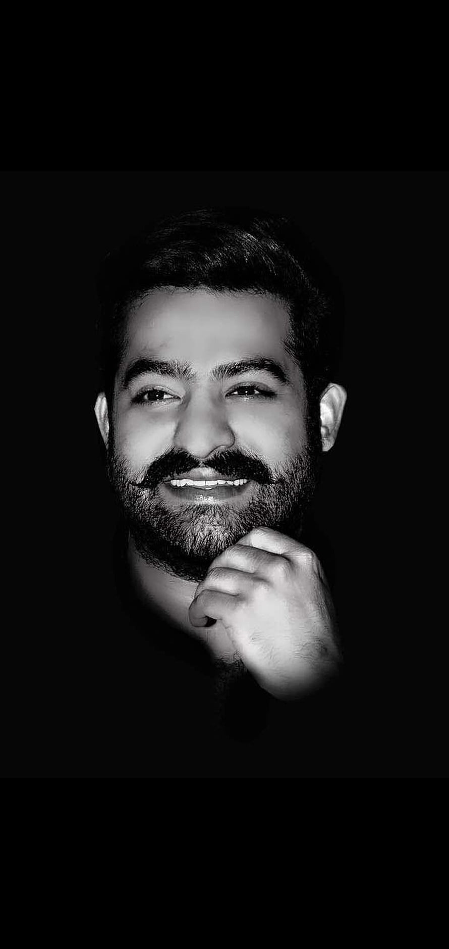 Black and White Portrait of NTR with Beard and Hand on Chin HD phone wallpaper