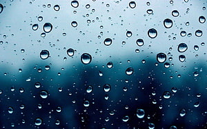 Raindrops on a Glass Window with a Moody Blue Gradient Background HD wallpaper