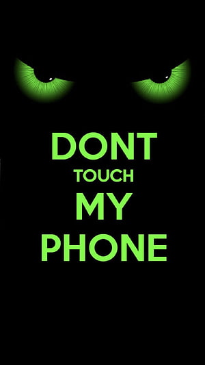 Glowing Green Eyes Staring from Darkness with Bold Warning Text on Black Background HD phone wallpaper