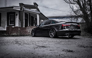 Black Audi A6 C7 Sedan Rear Three-Quarter View Parked on Gravel HD wallpaper