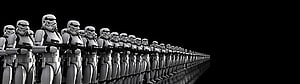 Stormtroopers standing in formation with blasters against a black background HD wallpaper