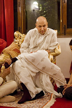 Mohit Sai in Traditional White Attire Seated on Ornate Golden Chair HD phone wallpaper