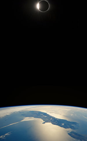 Total Solar Eclipse Over Earth's Curved Horizon From Space HD phone wallpaper