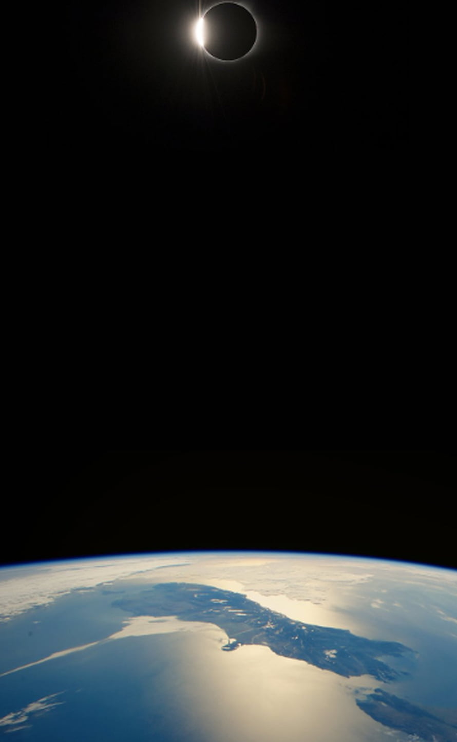 Total Solar Eclipse Over Earth's Curved Horizon From Space HD phone wallpaper