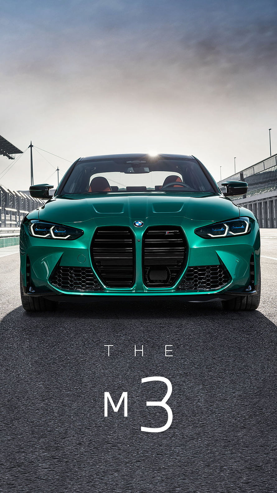 BMW M3 in Green on a Race Track with Dramatic Lighting HD phone wallpaper