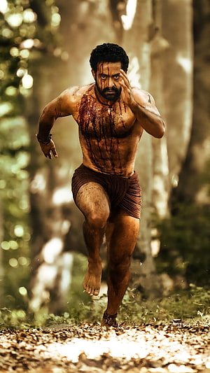 Komaram Bheem Running Through Forest in RRR Film Still HD phone wallpaper