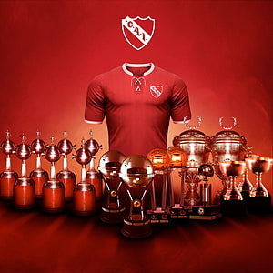 Club Atletico Independiente Red Jersey Display With Trophy Collection And Club Crest HD phone wallpaper