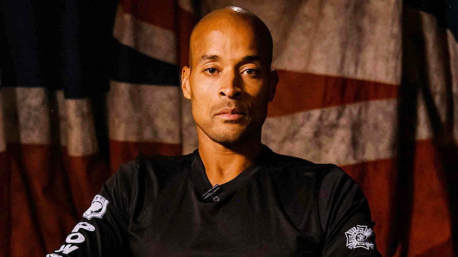 David Goggins Portrait In Black Shirt Against American Flag Background HD wallpaper