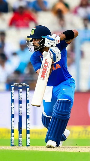 Virat Kohli Playing Cricket Shot in Blue India Jersey HD phone wallpaper