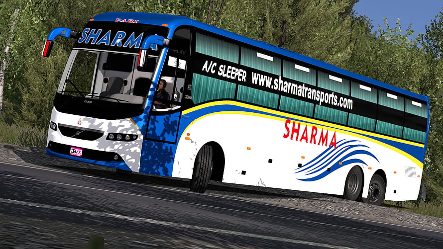 Volvo B11R Sleeper Bus in Blue and White Livery Driving on a Forest Road HD wallpaper