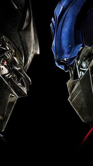 Transformers Optimus Prime and Megatron Face Off in Cinematic Close-Up HD phone wallpaper