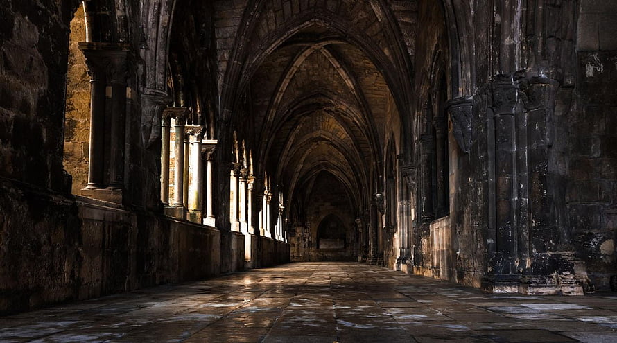 Atmospheric Gothic Cathedral Interior with Stone Arches and Sunlight HD wallpaper