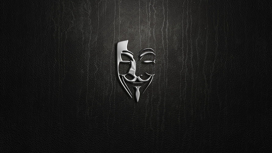 Metallic Guy Fawkes Mask on Dark Textured Background HD wallpaper